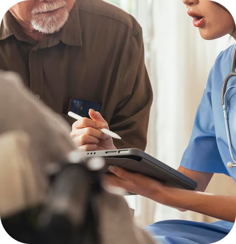 A male patient who is assisted by a nurse.